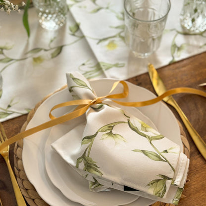 Elegant table runner featuring snowdrop and hellebore floral pattern by Avalon Home UK, perfect for spring and Easter decor.