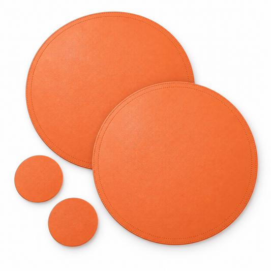 Set of two orange SophistiMat placemats and coasters by KitchBoom, featuring a stylish and durable design for dining or entertaining.
