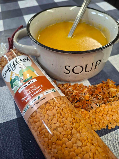 Crafty Cook Easy Meals FAMILY Plan image showing a bowl of spiced carrot and lentil soup with fresh herbs.