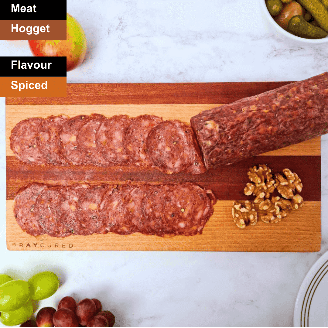 Sliced Bray Cured Hogget Chorizo charcuterie with spicy, flavorful slices arranged on a wooden board.