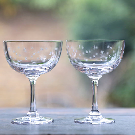 Pair of large crystal champagne saucers with a stars design by The Vintage List, featuring elegant star patterns on clear glass.