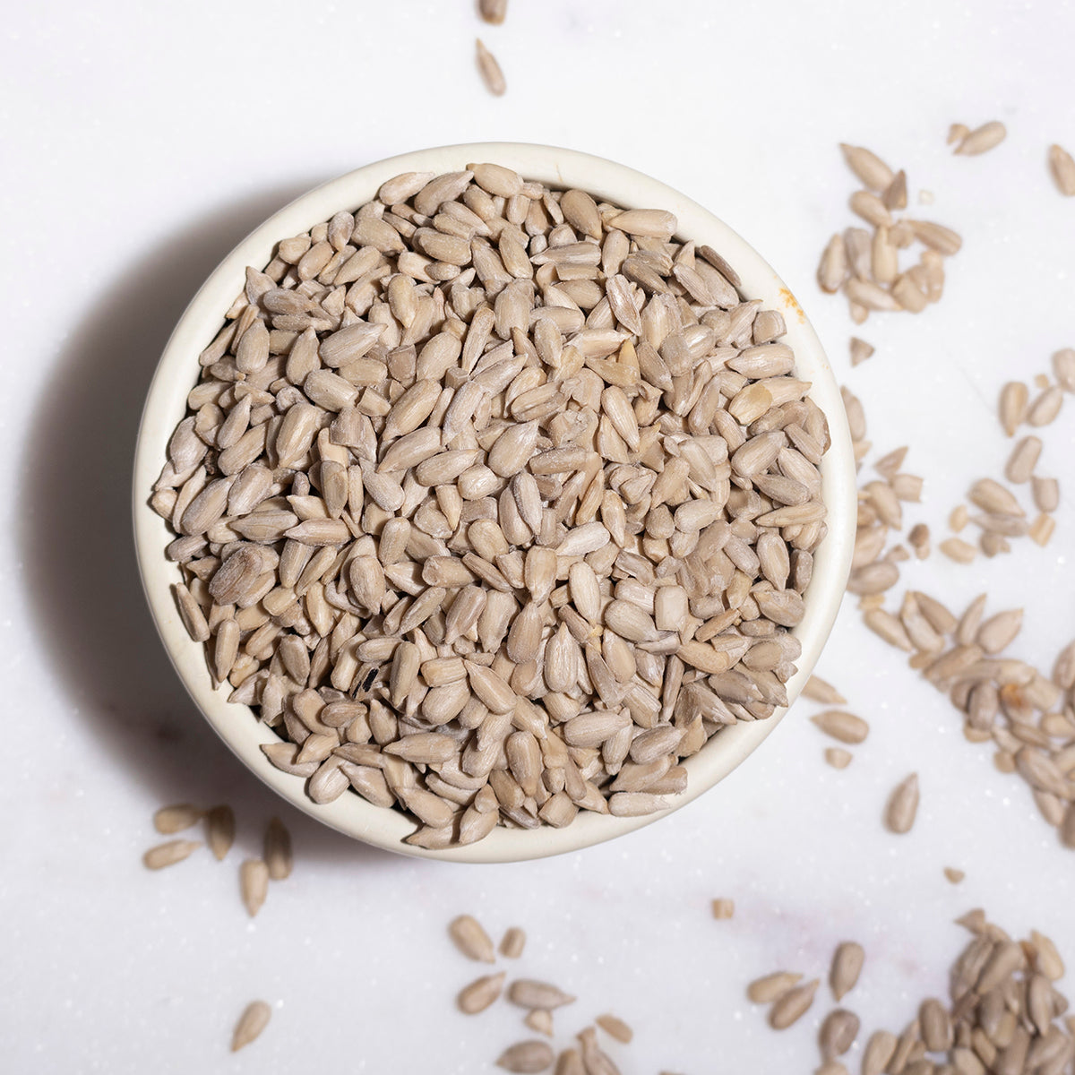 Whole Food Earth sunflower seeds, a nutritious nuts and seeds product, shown in a close-up image highlighting their natural appearance.
