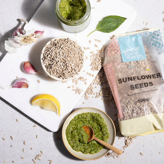Whole Food Earth sunflower seeds in a bowl, showcasing fresh, crunchy nuts and seeds in a natural setting.