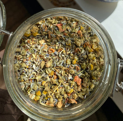 Porter Hill Tea Company's Sweet Dreams fruit and herbal tea in a cozy cup, featuring a blend of colorful herbs and fruit pieces.