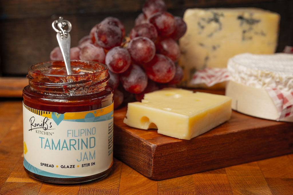 Filipino tamarind jam by RoniBs Kitchen, featuring a jar with tamarind and Tarsier Gin, ideal for cheese pairings.