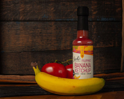 RoniBs Kitchen Filipino style banana ketchup bottle with bright label and squeeze cap, showcasing sweet and tangy condiment.
