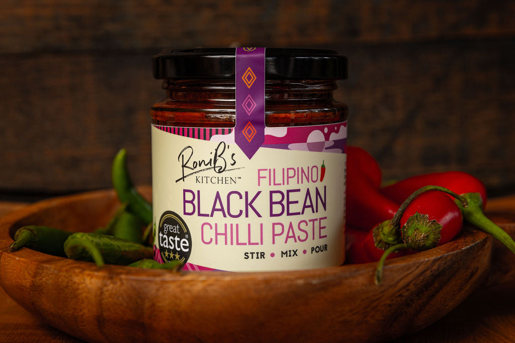 RoniBs Kitchen Filipino Black Bean Chilli Paste hot sauce, featuring dark chili and black bean ingredients, in a jar.