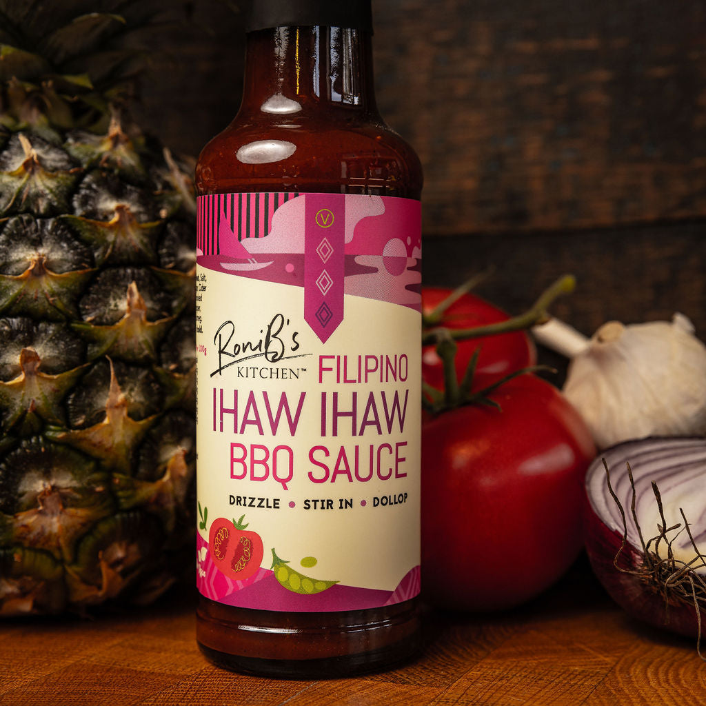 Filipino Style Ihaw Ihaw BBQ Sauce by RoniBs Kitchen in a bottle, showcasing vibrant marinade with spices and rich color.