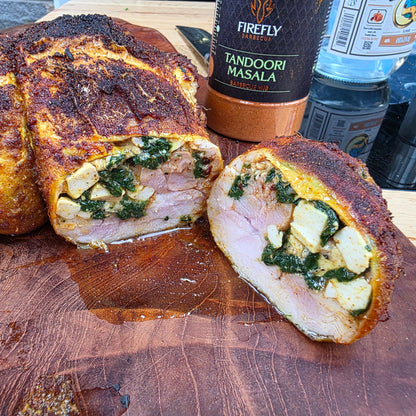 FireFly Barbecue Tandoori Spice Seasoning BBQ Rub on grilled chicken with vibrant spices and herbs.