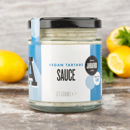 Creamy vegan tartare sauce by Janda with chopped herbs and pickles, served in a small bowl.
