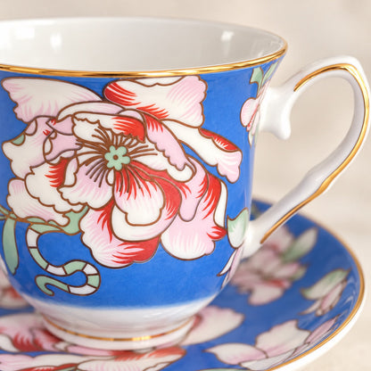 Close-up of a teacup from KitchBoom Rosewood Garden Tea Set for 6, featuring intricate floral design on ceramic teaware.