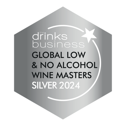 Turn 6 premium alcohol-free sparkling white wine with a silver medal label, showcasing a clear glass filled with bubbly white wine.