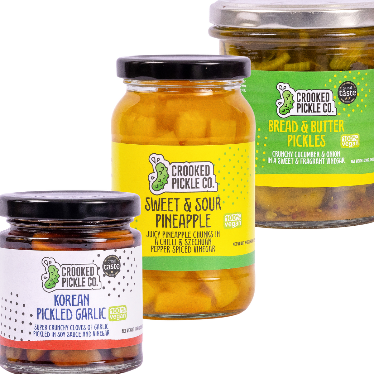 Assorted pickle jars from Crooked Pickle Co's OG Pickle Trio, featuring variety of pickled vegetables in glass containers.