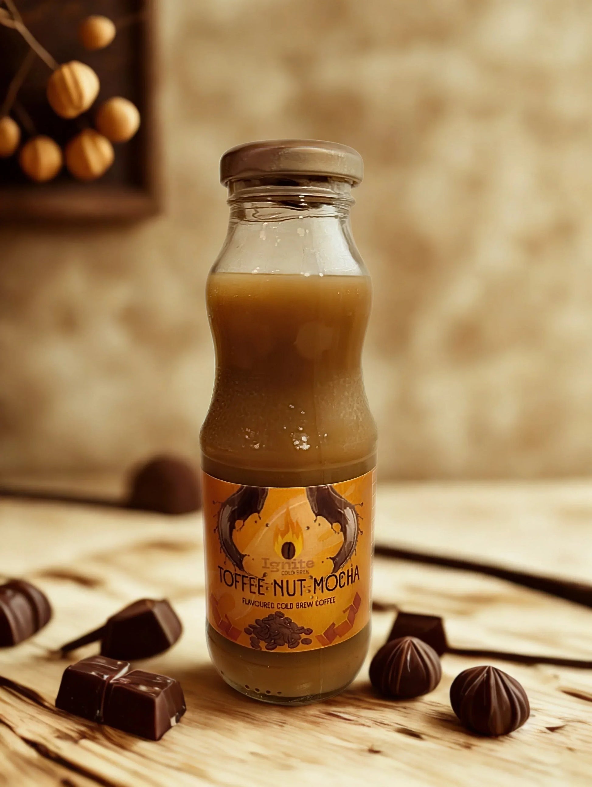 Six Ignite Coffee Co Mocha Pack cold brew bottles with toffee and nut flavors in a box, showcasing creamy mocha drinks.