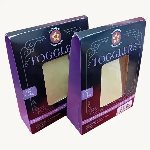 Friars Farm Northampton Cheese Co. Togglers cheese 150g, showing a block of creamy cheese with packaging label visible.