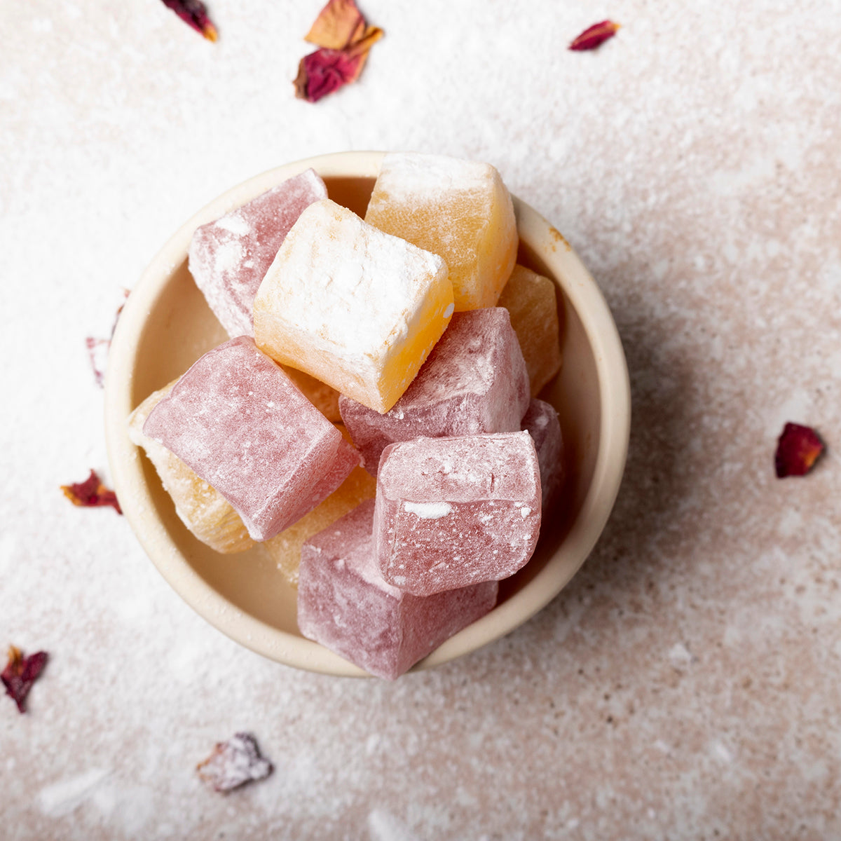 Turkish Delight with rose and lemon flavor, featuring colorful pieces of specialty Turkish confectionery on a white background.