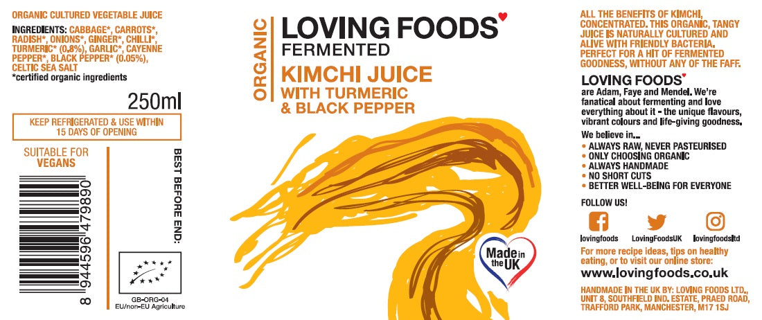 Assorted Loving Foods fermented vegetable juices including turmeric and kimchi flavors, in glass bottles on a rustic wooden table.