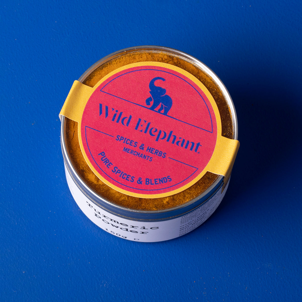 Ground turmeric powder from Wild Elephant brand, 150g, shown in a clear container, highlighting vibrant yellow color and fine texture.