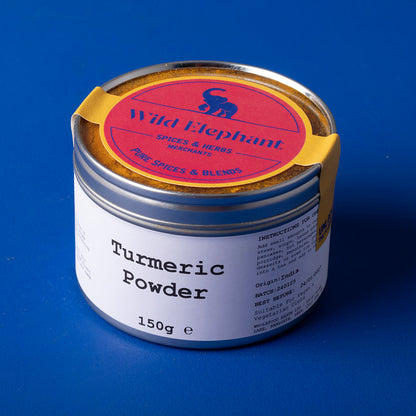 Golden yellow turmeric powder in a jar from Whole Food Earth, part of Wild Elephant herbs and spices collection.