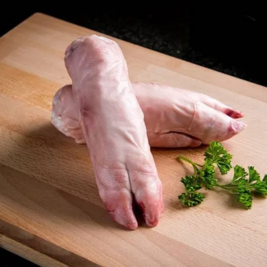 Two Cornish Heritage Breed Pig Trotters from Primrose Herd, fresh and natural, shown in a close-up image.