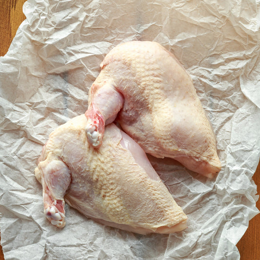 Raw free-range chicken supremes from Primrose Herd, showing fresh, boneless chicken cuts in natural light.