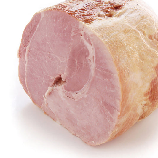 Primrose Herd Cornish outdoor-reared boned and rolled ham joint, 1-5kg, showing the sliced ham with a golden-brown exterior.