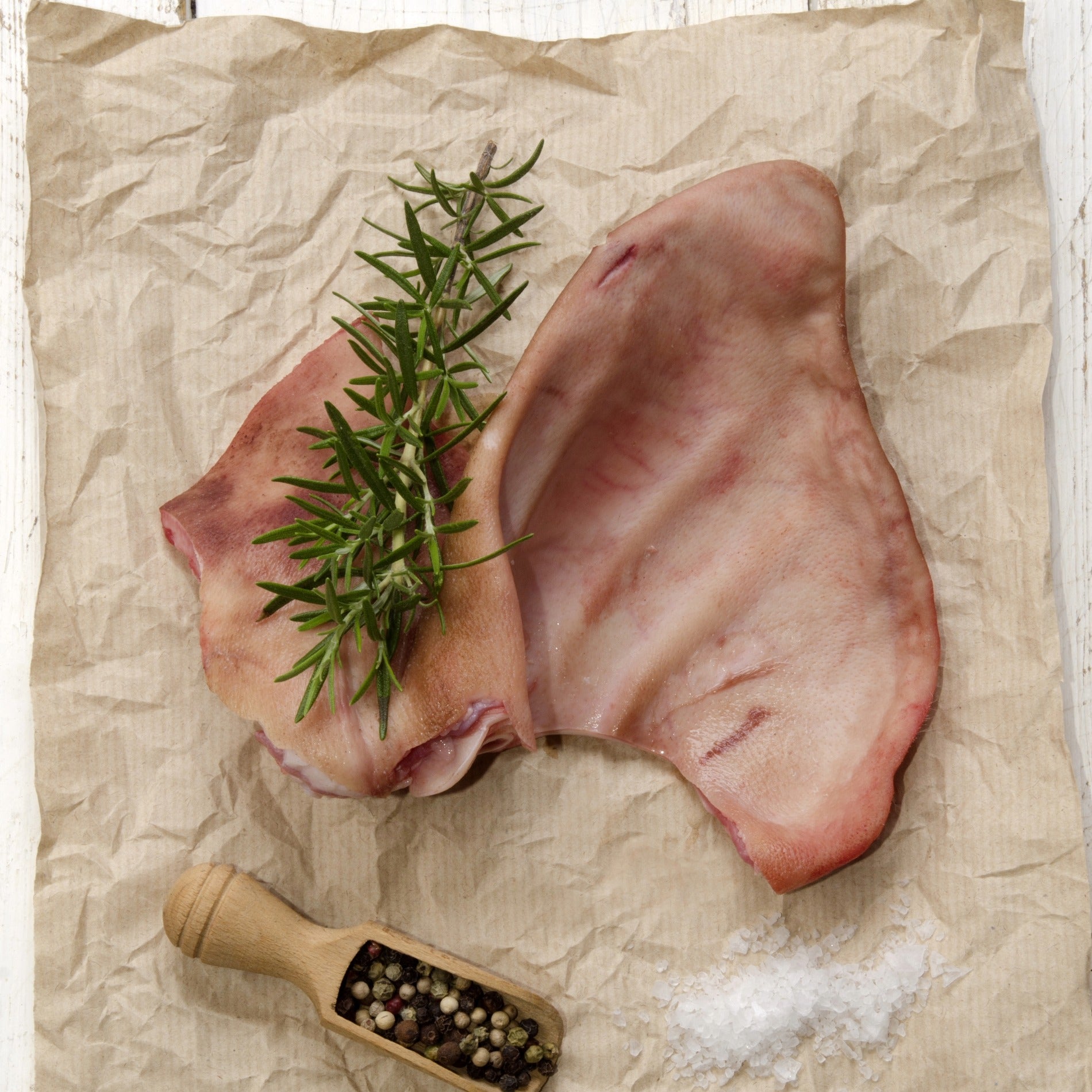 Primrose Herd Cornish Heritage Pork Pig's Ears, natural offal treat, showing fresh, textured pig ears on a clean surface.