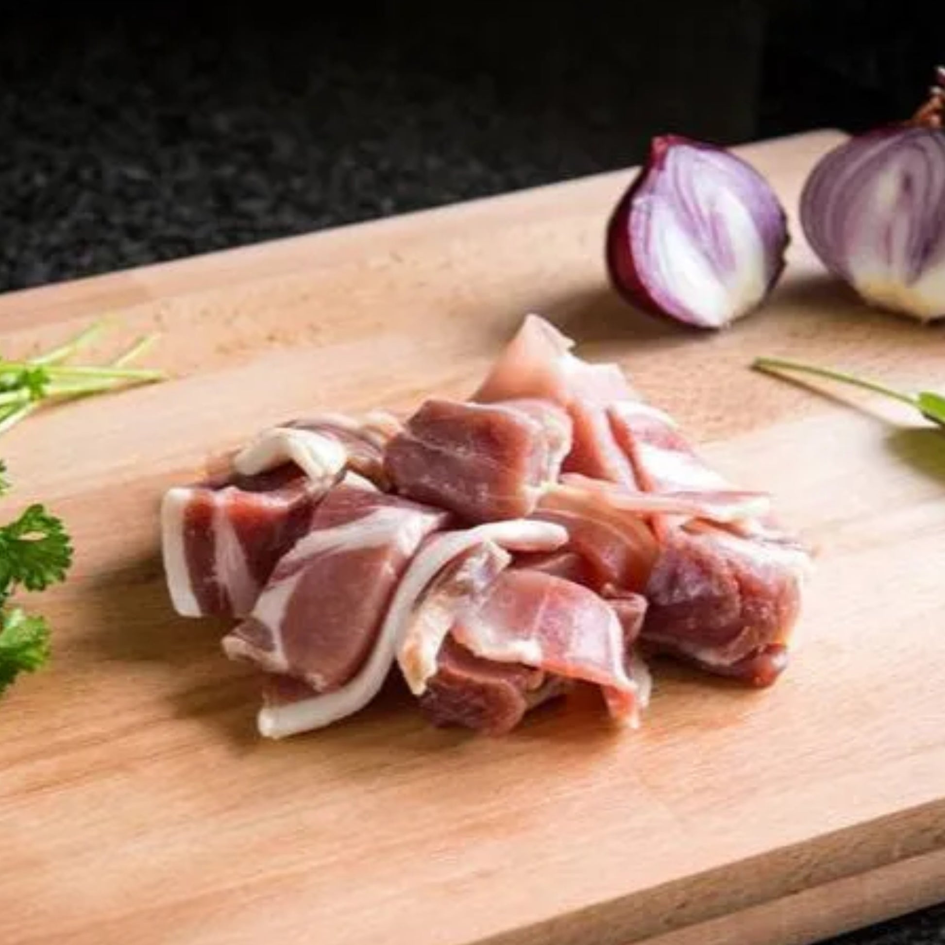 Primrose Herd Cornish Heritage Pork dry cured bacon pieces in a 500g package, showing crispy bacon slices ready to cook.