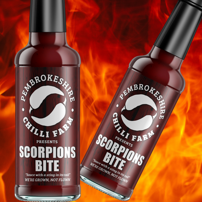 Pembrokeshire Chilli Farm hot sauce bottles featuring three chili sauces in vibrant packaging for spicy flavor.