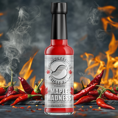 Pembrokeshire Chilli Farm Maple Madness Chilli Sauce bottle with label, showcasing vibrant red chili peppers and branding.