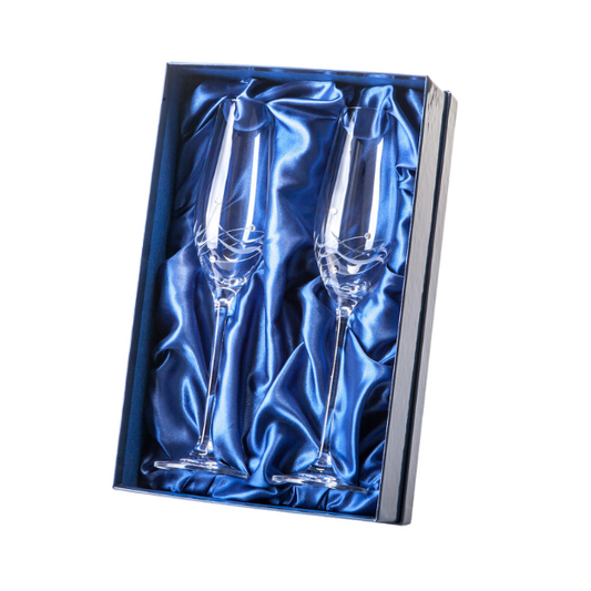 Set of Glassware UK champagne flutes with diamond and spiral cut design, presented in a gift box for elegant celebration.
