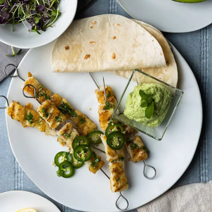 Glassware UK Manna Plate 11.5-inch ceramic plate with a smooth, curved edge and minimalist design, perfect for serving or display.