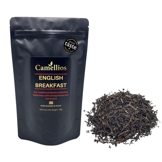 Loose leaf English Breakfast tea from Camellios with golden-brown tea leaves and a traditional tea blend in a clear glass jar