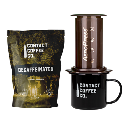 Contact Coffee Company Ltd. coffee care package with assorted coffee beans and brewing accessories on a white background.