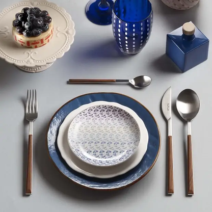 Glassware UK Pintinox Sushi Mahogany 24-piece cutlery set, includes knives, forks, and spoons with mahogany handles.