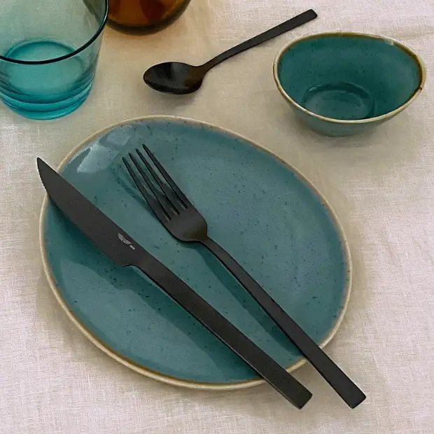 24-piece Pintinox Duke Satin Black cutlery set featuring sleek knives, forks, and spoons with a modern satin black finish.