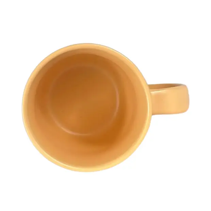 Peach ceramic coffee mug from Glassware UK, featuring a smooth, rounded shape and a sturdy handle for hot beverages.