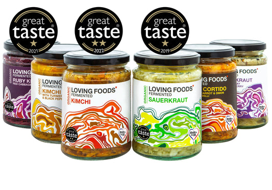 Assorted jars of Loving Foods fermented vegetables mixed case with colorful vegetables in glass jars for probiotic-rich eating.