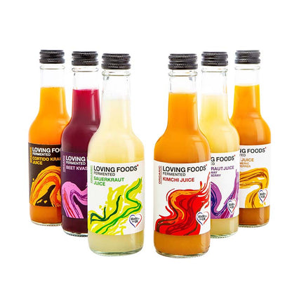 Six bottles of Loving Foods fermented vegetable juice mixed case, featuring colorful bottles of probiotic vegetable drinks.