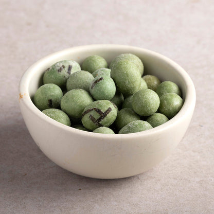 Whole Food Earth wasabi peanuts in a bowl, showing spicy, crunchy specialty nuts with wasabi coating and fresh ingredients.