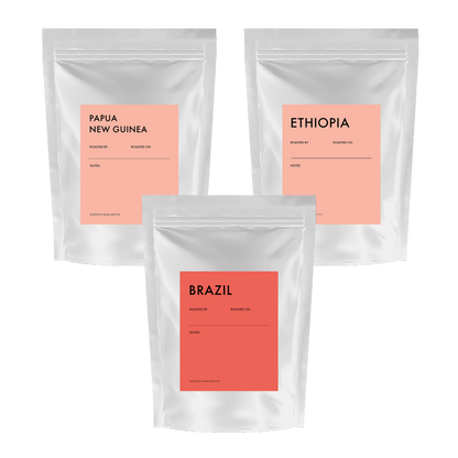 Small Batch Coffee Global Discovery Kit with single origin coffee tasting set, featuring small sample packs and a tasting guide.