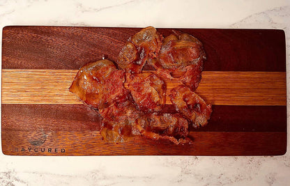 Slices of Bray Cured Guanciale charcuterie with marbled pork, ready for cooking or serving as a flavorful addition.
