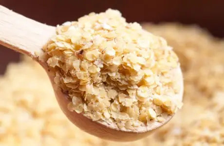 Organic Whole Food Earth wheatgerm in a clear glass jar, showing its golden, nutrient-rich wheatgerm grains.