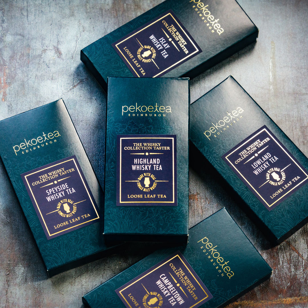 PekoeTea Edinburgh Whisky Tea Collection Explorer Set featuring assorted tea tins with whisky-inspired flavors and elegant packaging.