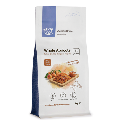 Dried medium apricots from Whole Food Earth in a 1kg package, showing dried orange apricots with textured surface.