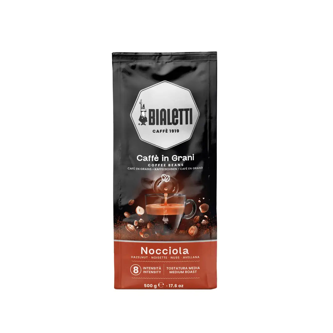 Bialetti Brew Italia whole bean coffee with hazelnut flavor in a 500g bag, showing the coffee beans and packaging.