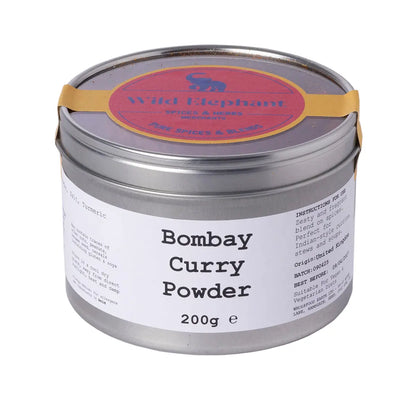 Wild Elephant Bombay Curry Powder from Whole Food Earth, a colorful blend of spices in a jar, ideal for authentic curry dishes.
