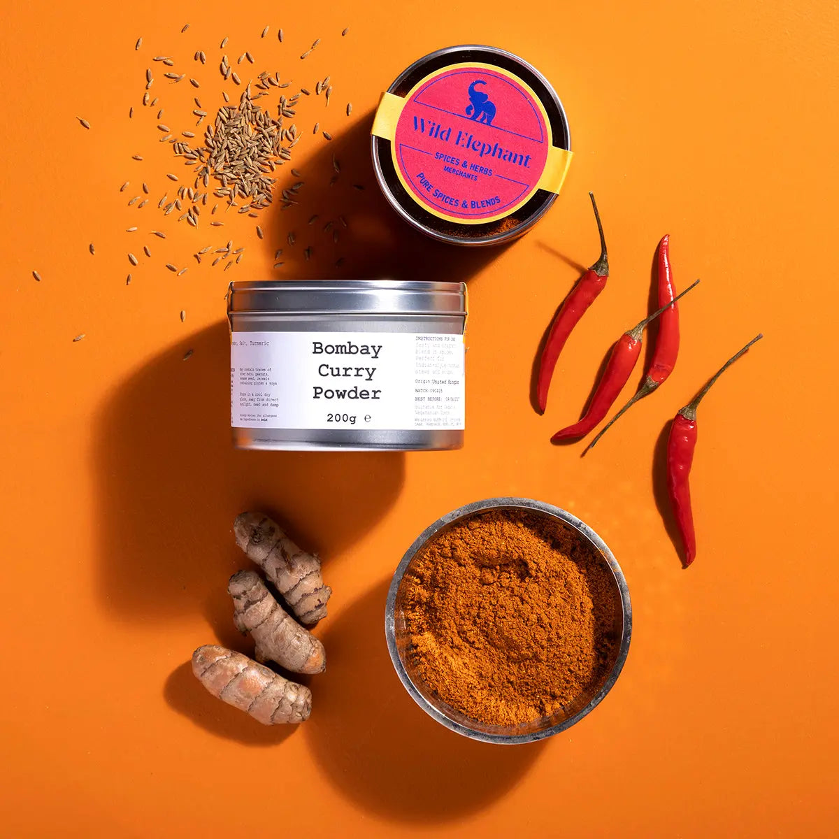 Close-up of Wild Elephant Bombay Curry Powder in a jar, highlighting the vibrant spice blend from Whole Food Earth.