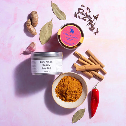 Wild Elephant Hot Thai Curry Powder in a spice jar, part of Whole Food Earth's seasonings and spices collection.