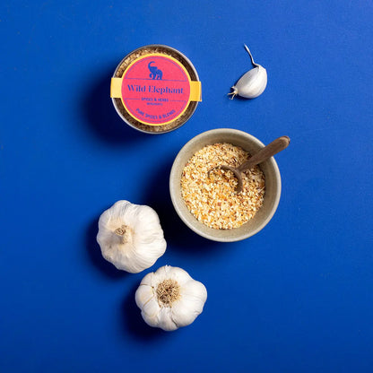 Organic garlic granules from Wild Elephant, shown in a clear container, highlighting the herbs and spices product from Whole Food Earth.